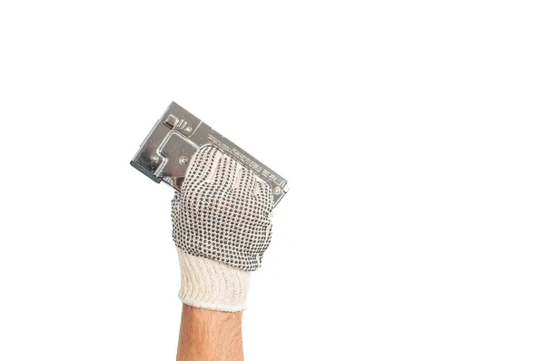 Herramienta. Guante de mano sostiene grapadora industrial sobre fondo blanco  . — Foto de Stock