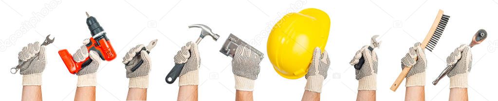 Hands holding construction tools isolated on white background.