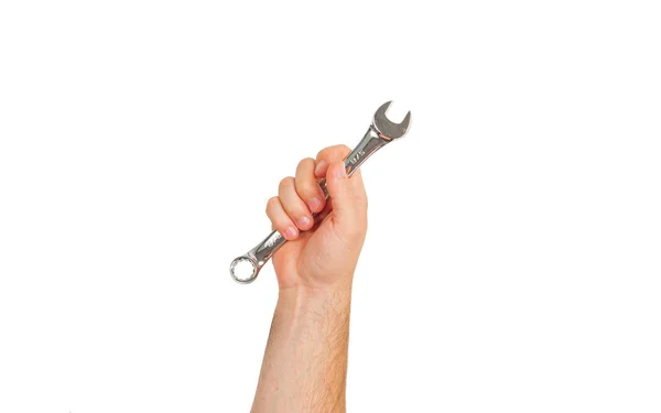 Инструмент. Рука держит гаечный ключ на белом фоне . — стоковое фото