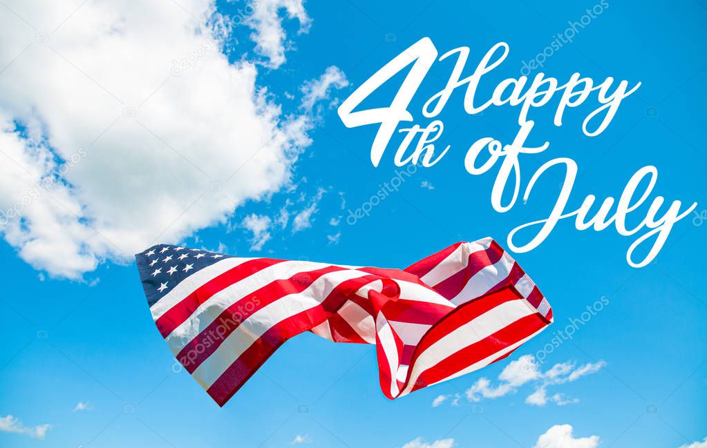 Happy 4th of July Independence day. American flag in blue sky background. 