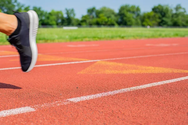 Close-up feet of woman on track, runner on running lane — Stock Photo, Image