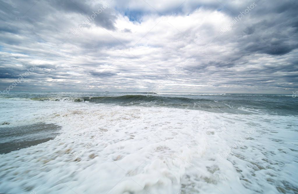 Ocean. Beach with white sand and cloudy sky