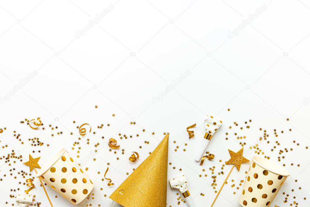 Celebration background - party accessories in golden colors. Copy space.