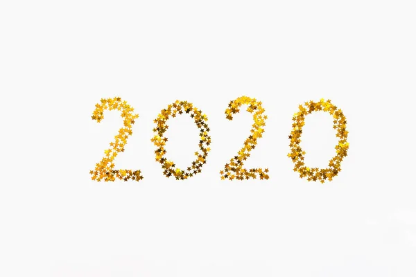 New 2020 Year golden star shaped confetti background. — Stock Photo, Image