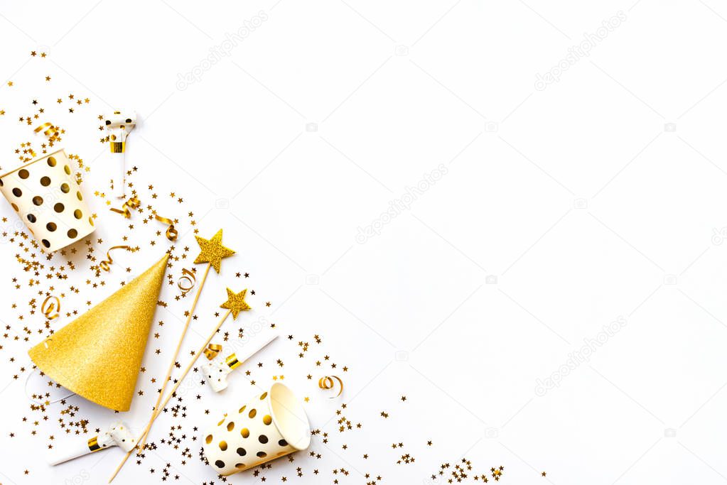 Celebration background - party accessories in golden colors. Copy space.