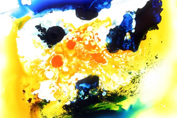 Colored liquids mixed together in fluid creating colorful abstract painting