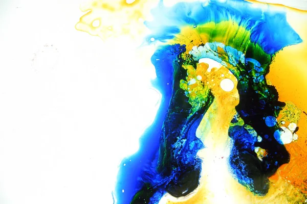 Colored liquids mixed together in fluid creating colorful abstract painting