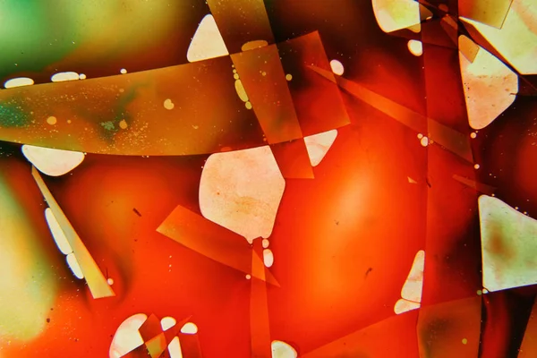 Colored liquids mixed together in fluid creating colorful abstract painting