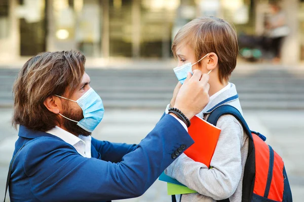 Dad Putting Protective Mask His Son Face Outdoors Schoolboy Ready — Stock Photo, Image