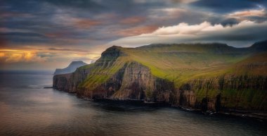 Cliffs of Eysturoy island in sunset light, Faroe Islands clipart