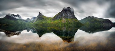 Panorama of Steinfjorden among mountains and forest on Senja Island, Norway clipart