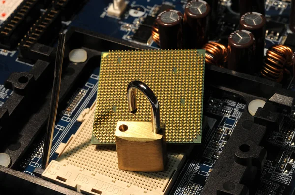 CPU Chip Processor and padlock over motherboard. Security Concept.