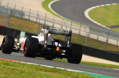 MUGELLO, ITALY - MAY 2012: Kamui Kobayashi of Sauber F1 Team races on training session in Mugello Circuit, Italy. clipart