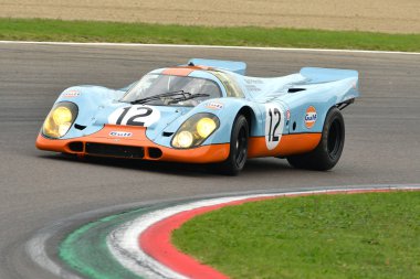 Imola Classic 26 October 2018: Porsche 917 1970 Gulf Livery ex Attwood/Elford driven by Claudio Roddaro during practice session on Imola Circuit, Italy. clipart