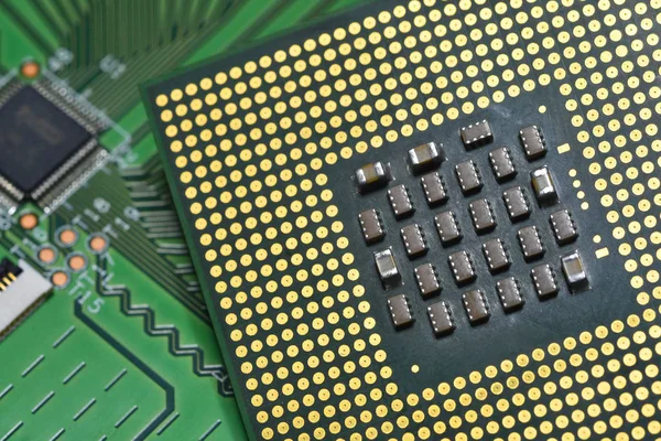 Closeup of CPU chip over electronic circuit