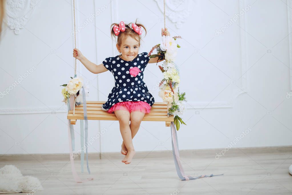 adorable little girl on a swing