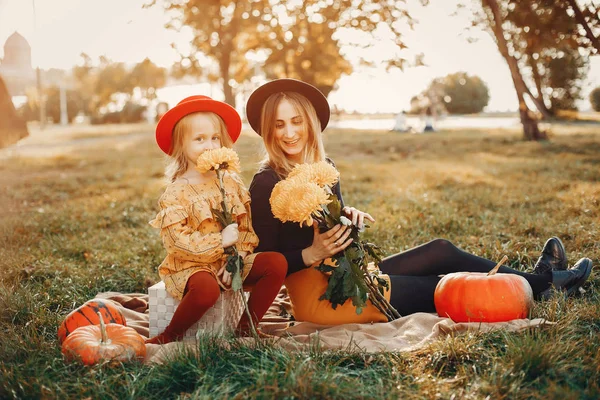 Family with pumpkins — Stock Photo, Image