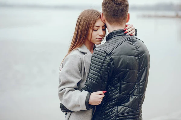 Loving couple walking around the river. — Stock Photo, Image