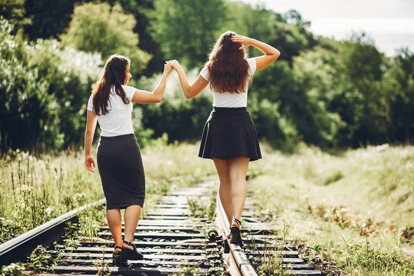 Cute sisters in a park — Stock Photo, Image