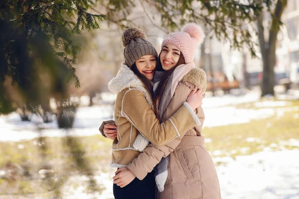 Happy girls in a winter city — Stok Foto