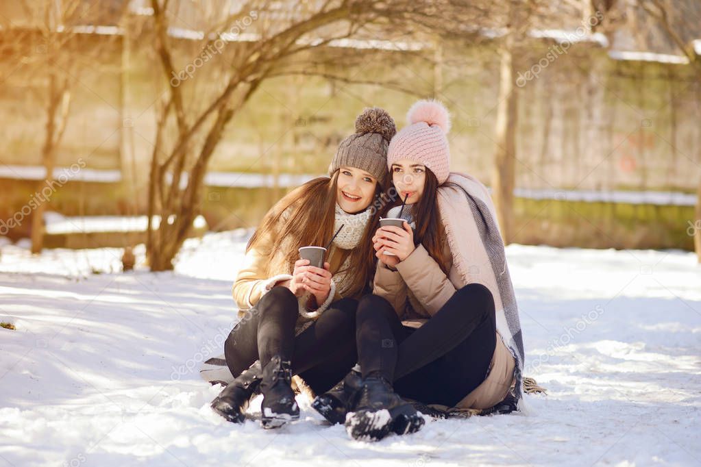 Happy girls in a winter city