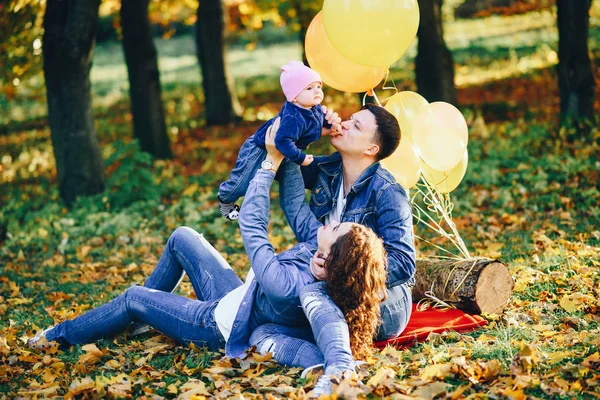 Beautiful family in a park — Stock Photo, Image