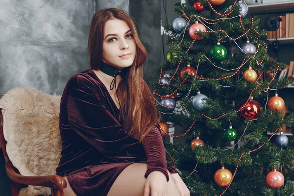 Girl near christmas tree — Stock Photo, Image