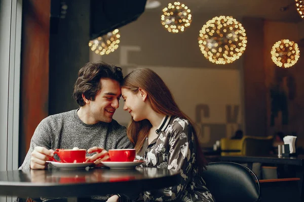 Cute couple spend time in a cafe — Stock Photo, Image