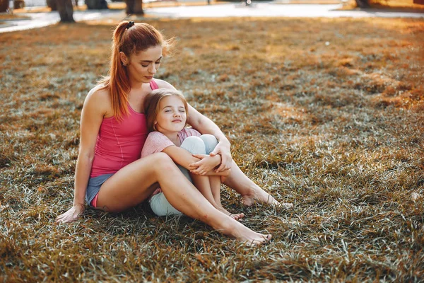 Sports family in a summer park — Stock Photo, Image