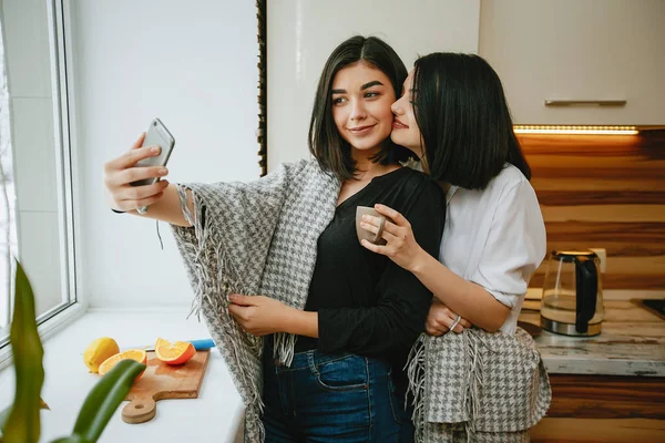 Girls near window — Stock Photo, Image