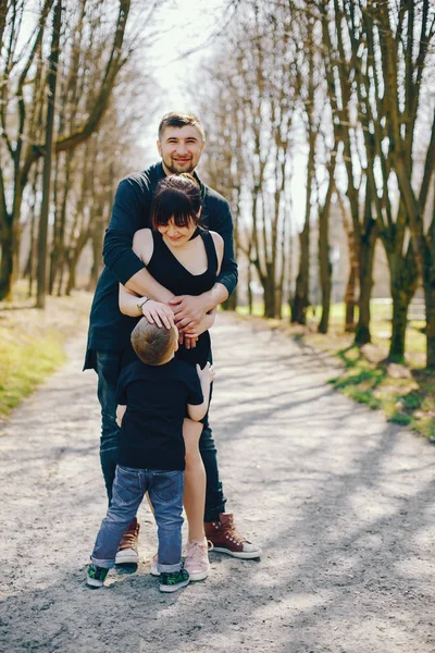 Cute family in a park — Stock Photo, Image