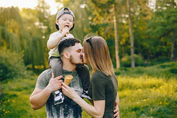 Cute family in a park — Stock Photo, Image