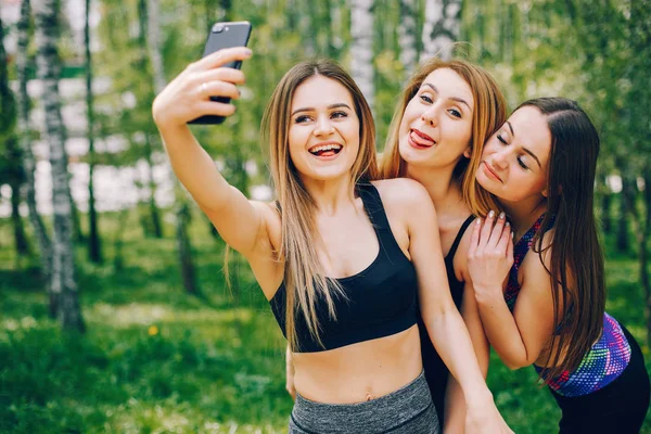 Sports girls in a park — Stock Photo, Image