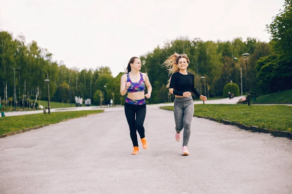 Sports girls in a park — Stock Photo, Image