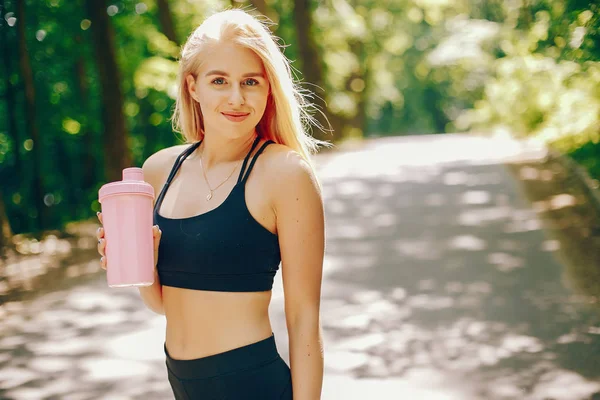 Sports girl in a park — Stock Photo, Image