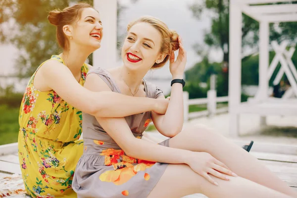 Two pretty girls in a summer park — Stock Photo, Image