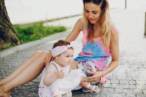 Mom resting with her daughter