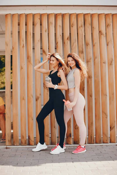 Two athletic girls have a rest — Stock Photo, Image