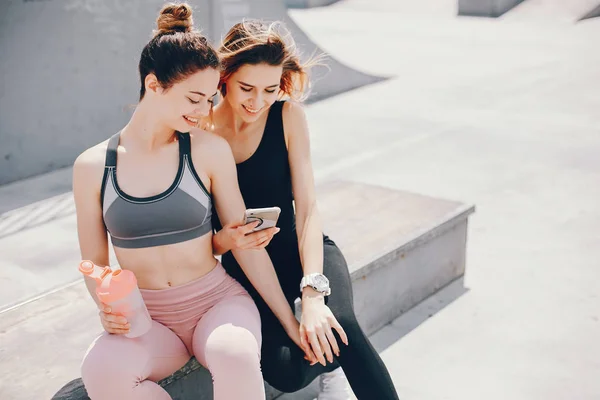 Two athletic girls have a rest — Stock Photo, Image