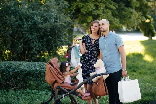 Family with shopping bag in a city