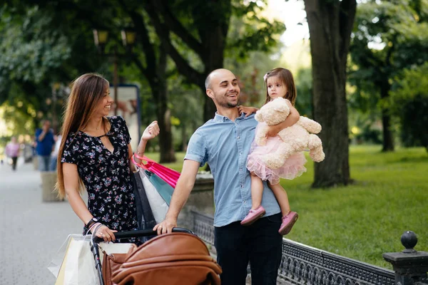 Family with shopping bag in a city