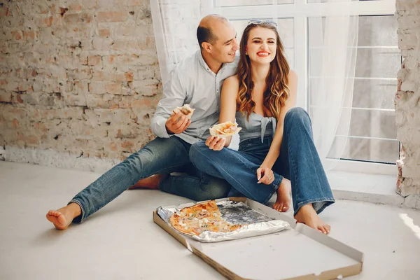 Couple with pizza