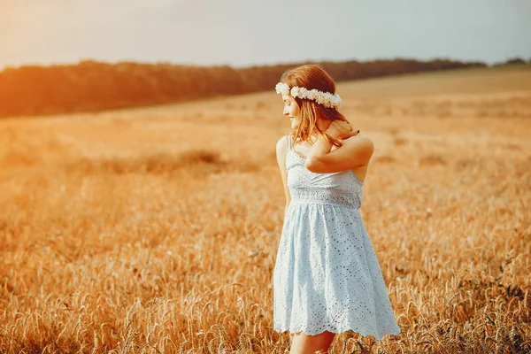 Beautiful girl have a rest in a field — Stock Photo, Image