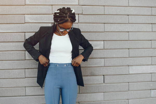 Elegant black girl in a summer city