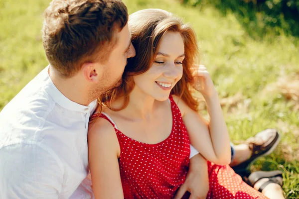 Beautiful couple spend time on a summer field — Stock Photo, Image