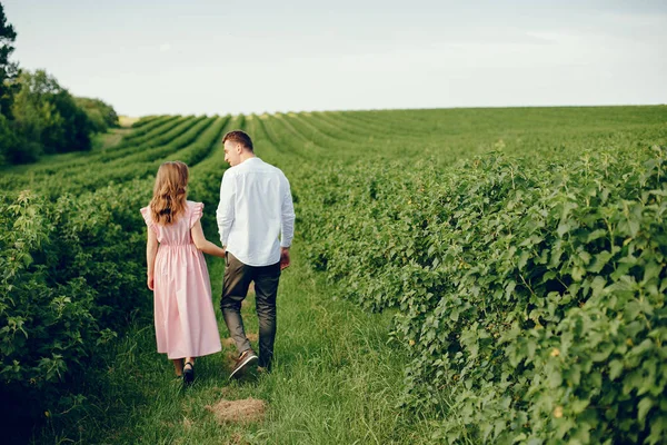 Beautiful couple spend time on a summer field — Stock Photo, Image