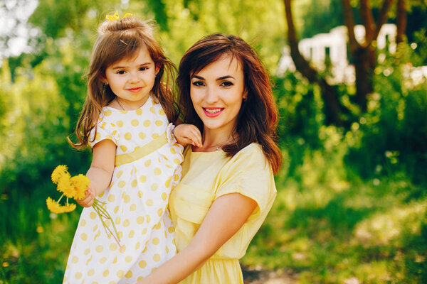mother with daughter in a solar park