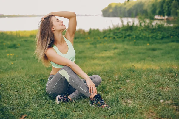 Sports girl in a park — Stock Photo, Image