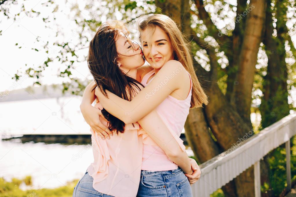 two beautiful girls in a park