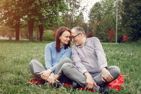 Beautiful adult couple in a summer forest — Stock Photo, Image